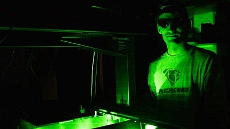 a person with green lasers